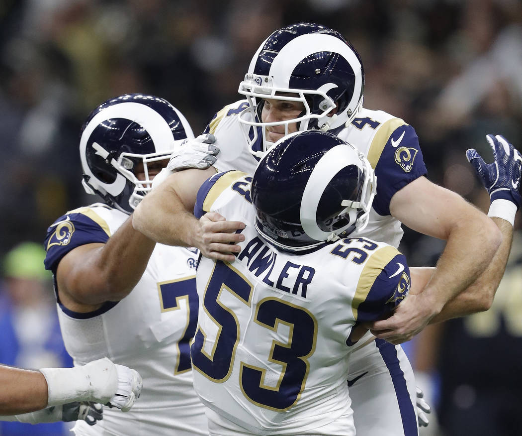 Los Angeles Rams' Greg Zuerlein is congratulated after making the game-winning field goal during overtime of the NFL football NFC championship game against the New Orleans Saints Sunday, Jan. 20, ...