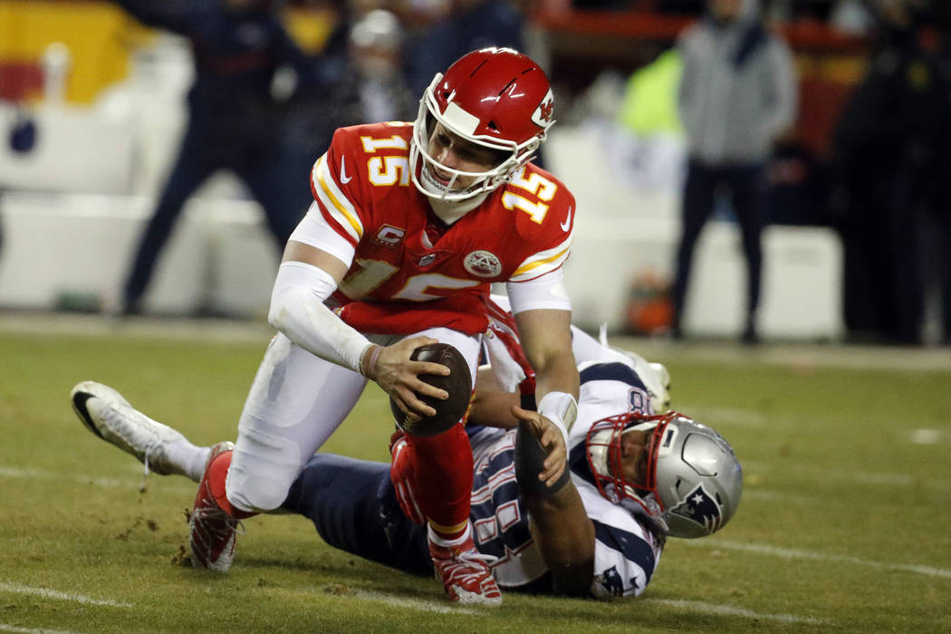 Kansas City Chiefs quarterback Patrick Mahomes (15) is sacked by