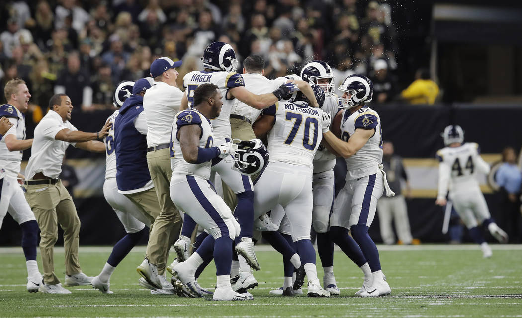 Los Angeles Rams celebrate after overtime of the NFL football NFC championship game against the New Orleans Saints, Sunday, Jan. 20, 2019, in New Orleans. The Rams won 26-23. (AP Photo/Carolyn Kaster)