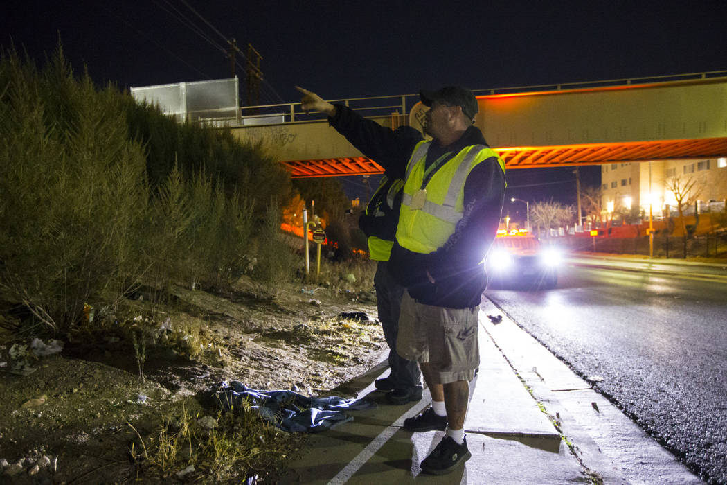 William Kight, center, looks for homeless people during the annual Southern Nevada Homeless Cen ...