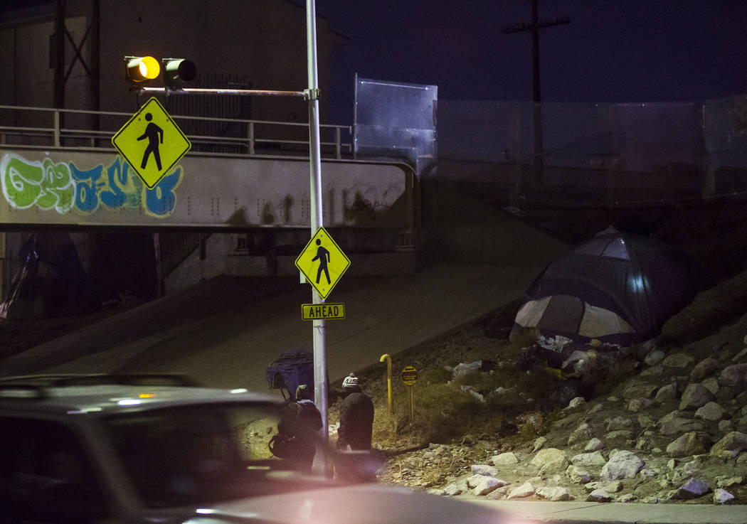 A light glows from inside a tent along Owens Avenue during the annual Southern Nevada Homeless ...