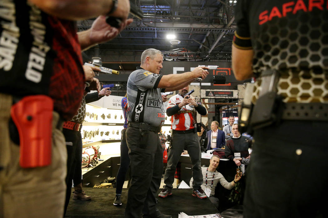 Keith Garcia of Team Safariland participates in a fast magazine reloading demonstration during the SHOT Show at the Sands Expo Convention Center in Las Vegas, Tuesday, Jan. 22, 2019. Erik Verduzco ...