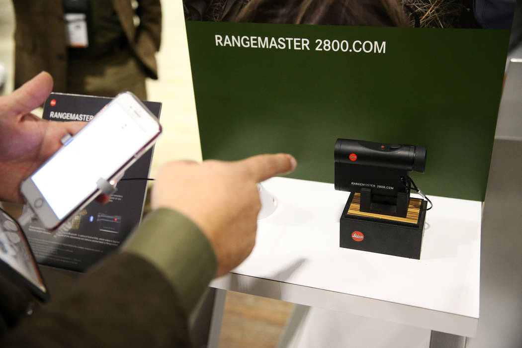 Hamilton Boykin, eastern sales manager for Leica, gives a demonstration of the newly released Rangemaster CRF 2800 during the SHOT Show at the Sands Expo Convention Center in Las Vegas, Tuesday, J ...