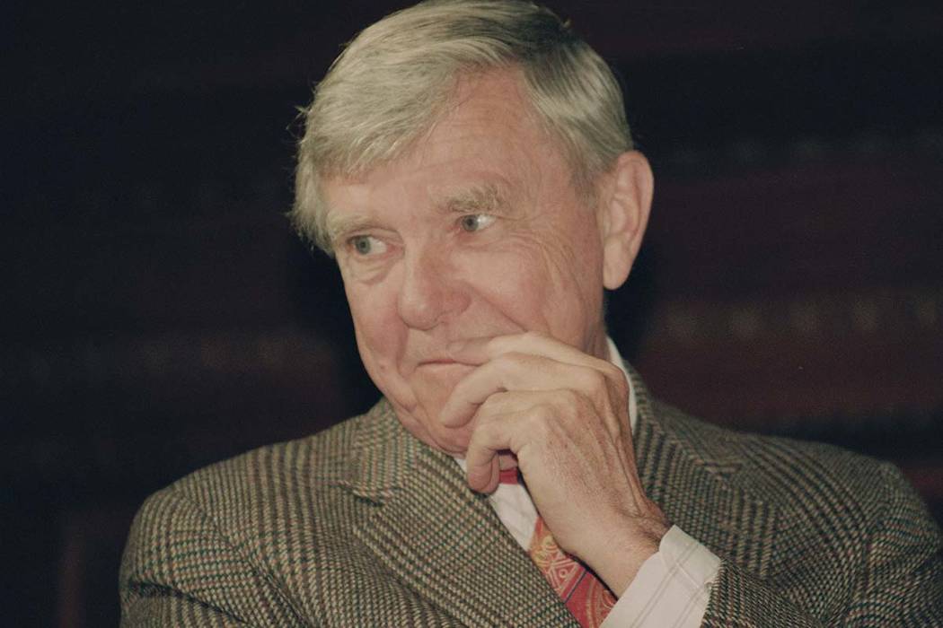 In this Tuesday, Feb. 23, 1993 file photo, writer Russell Baker, ponders a reporter's question during a New York news conference where he was presented as the successor to host Alistair Cooke for ...