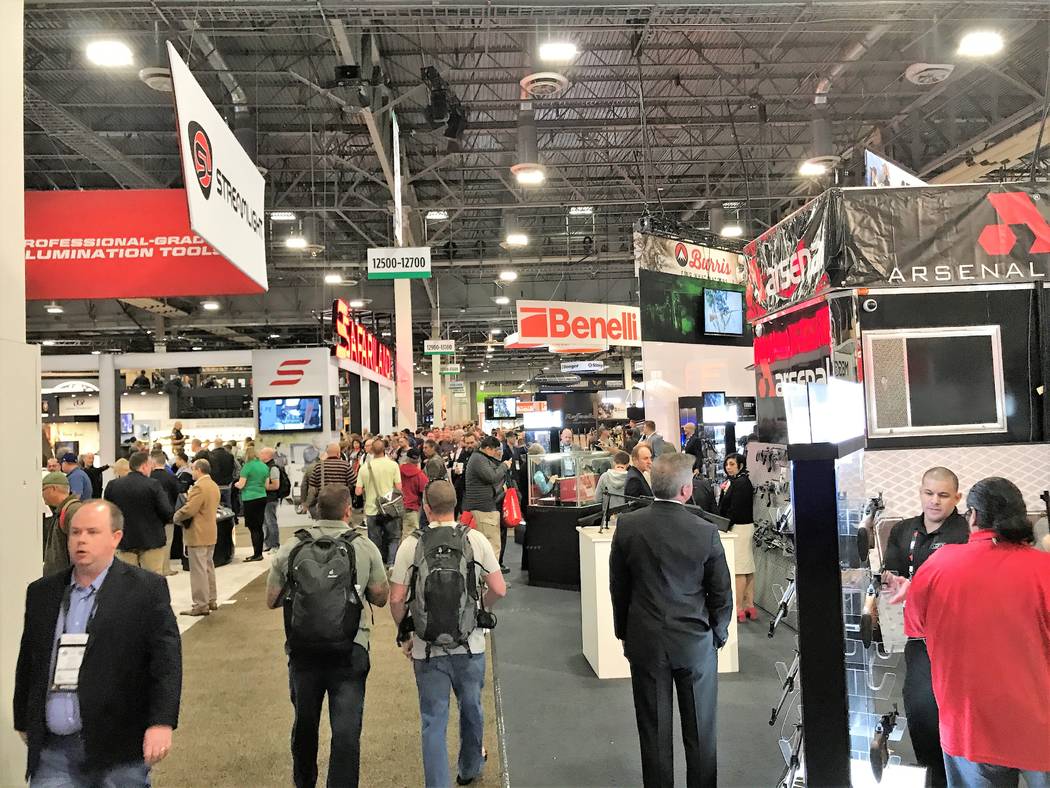 People from all 50 states and more than 100 countries find more than 12.5 miles of aisles lined with industry-related exhibits during the Shooting, Hunting and Outdoor Trade (SHOT) Show in Las Veg ...