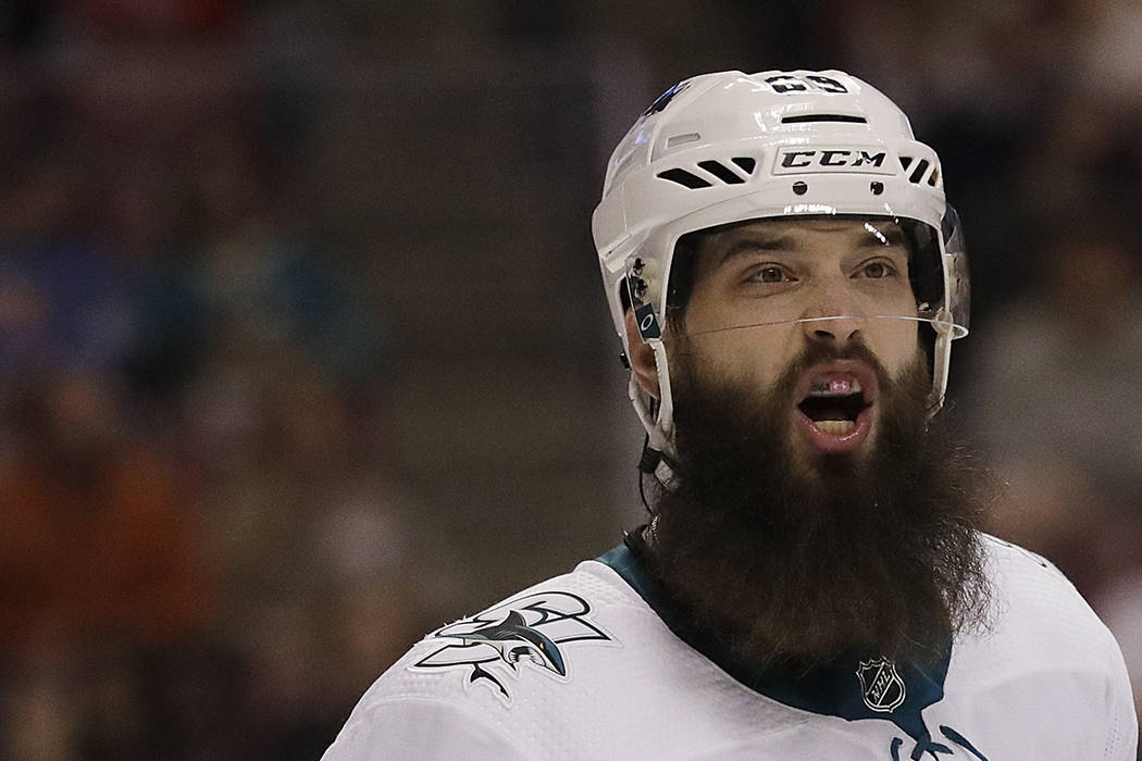 San Jose Sharks defenseman Brent Burns talks to a teammate during the second period of an NHL hockey game against the Florida Panthers, Monday, Jan. 21, 2019, in Sunrise, Fla. (AP Photo/Brynn Ande ...