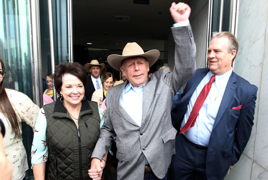 Cliven Bundy walks out of Lloyd George U.S. Courthouse in Las Vegas a free man with his wife Carol Monday, Jan. 8, 2018, after a federal judge dismissed the case with prejudice against him, two of ...