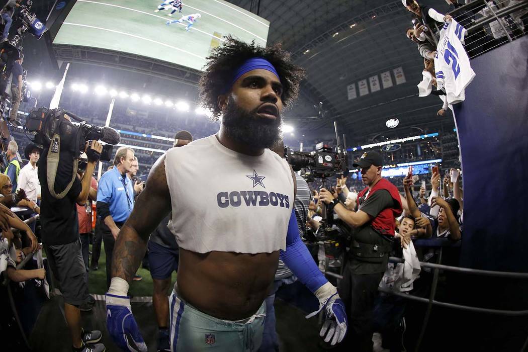 Dallas Cowboys running back Ezekiel Elliott (21) heads to the clubhouse after an NFC wild-card NFL football game against the Seattle Seahawks in Arlington, Texas, Saturday, Jan. 5, 2019.(AP Photo/ ...