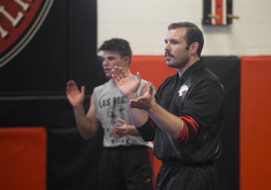 Coach Zach Hocker, right, gives direction during wrestling practice on Friday, Jan. 25, 2019, at Las Vegas High School, in Las Vegas. (Benjamin Hager/Las Vegas Review-Journal) @BenjaminHphoto