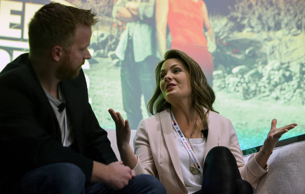 Eric and Lindsey Bennett, stars of HGTV's "Desert Flippers" speak during a panel on flipping houses during the second day of the Las Vegas Market held at the World Market Center in Las Vegas, Mond ...
