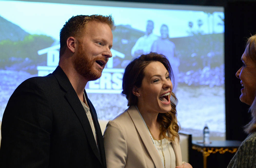 Eric and Lindsey Bennett, stars of HGTV's "Desert Flippers" speak with Cheryl Jones after a panel on flipping houses during the second day of the Las Vegas Market held at the World Market Center i ...