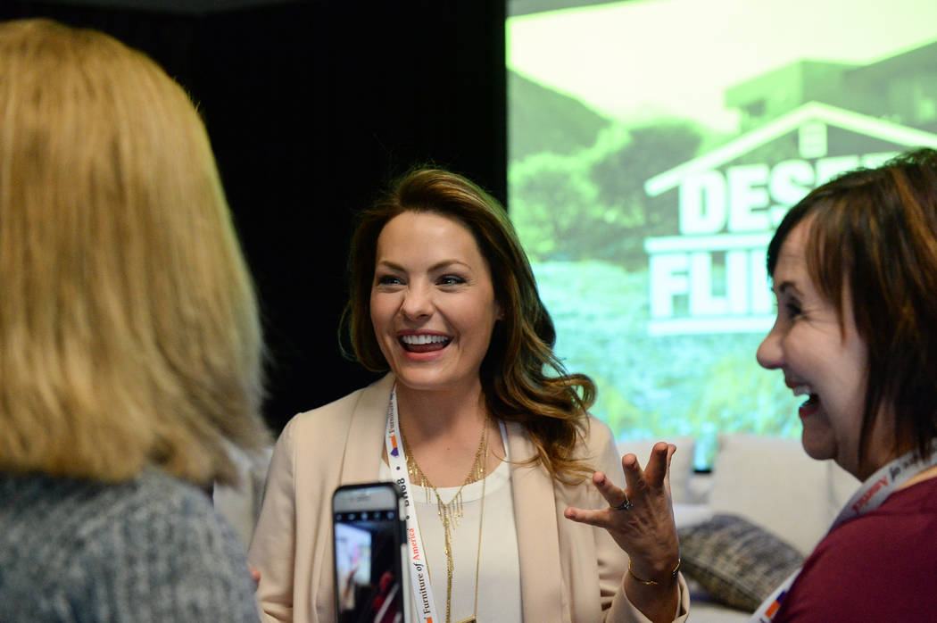 Lindsey Bennett, one of the stars of HGTV's "Desert Flippers" speaks with attendees after a panel on flipping houses during the second day of the Las Vegas Market held at the World Market Center i ...