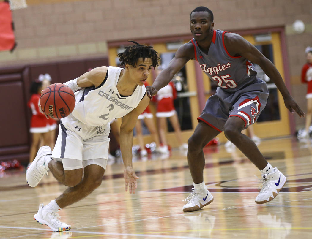 Faith Lutheran's Donavan Jackson (2) drives the ball against Arbor View's Larry Holmes (25) during the second half of a basketball game at Faith Lutheran High School in Las Vegas on Thursday, Jan. ...