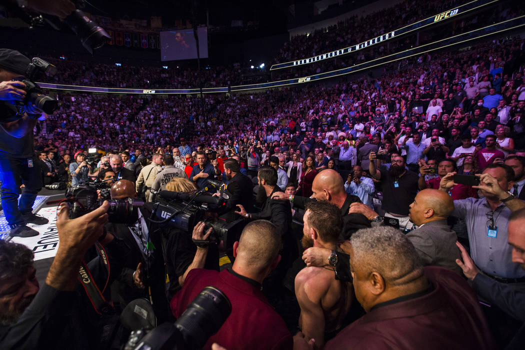 Conor McGregor leaves the octagon after his loss to Khabib Nurmagomedov in their lightweight title bout at UFC 229 at T-Mobile Arena in Las Vegas on Saturday, Oct. 6, 2018. Chase Stevens Las Vegas ...