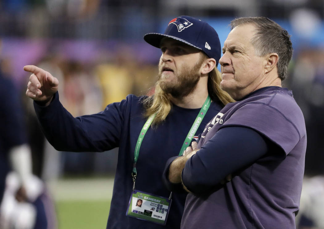 New England Patriots head coach Bill Belichick, right, talks to his son Steve Belichick on the field, before the NFL Super Bowl 52 football game against the Philadelphia Eagles, Sunday, Feb. 4, 20 ...