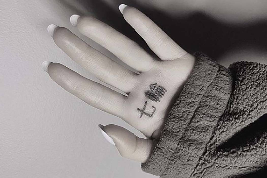 Ariana Grande's tattoo says Japanese BBQ grill not 7 Rings | PerthNow