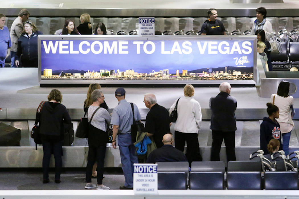 People wait to retrieve luggage at McCarran International Airport (Ronda Churchill/Las Vegas Review-Journal)
