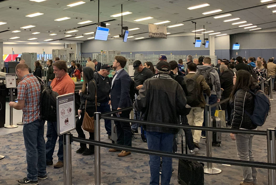 Passengers wait in the TSA screening line at McCarran International Airport. (Mick Akers/Las Vegas Review-Journal)