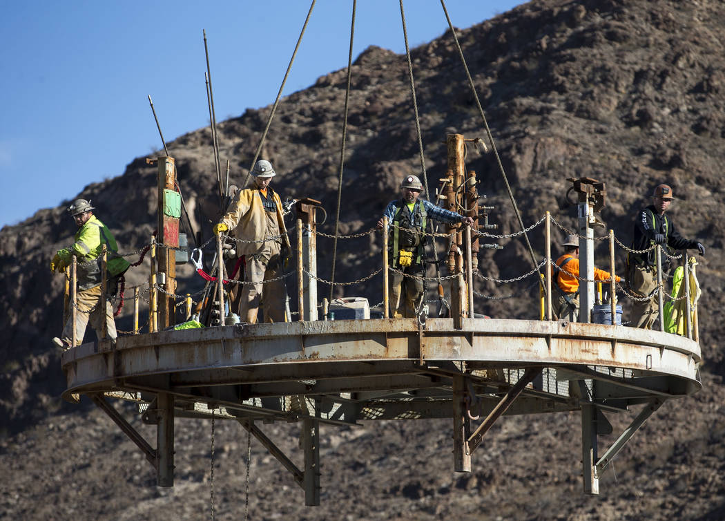 Workers prepare to be lowered down the access shaft for Southern Nevada Water Authority's low-lake-level pumping station at Lake Mead National Recreation Area on Tuesday, Nov. 27, 2018. Richard Br ...
