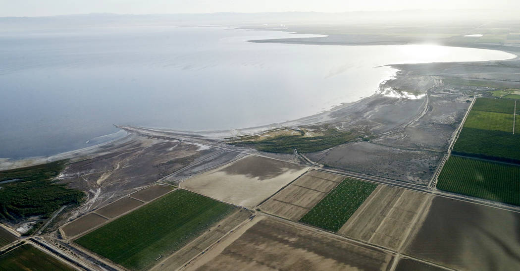 FILE - This May 1, 2015 file photo shows the exposed lake bed of the Salton Sea drying out near Niland, Calif. Work on a multistate plan to address drought on the Colorado River in the U.S. West w ...
