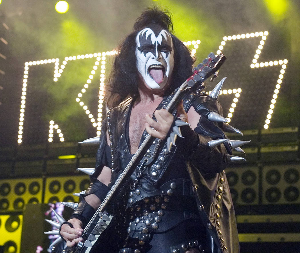 In this Tuesday, July 20, 2004 file photo, Gene Simmons, bass player for the band Kiss, performs during their performance at the PNC Bank Arts Center in Holmdel, N.J. The heavy metal veterans are ...