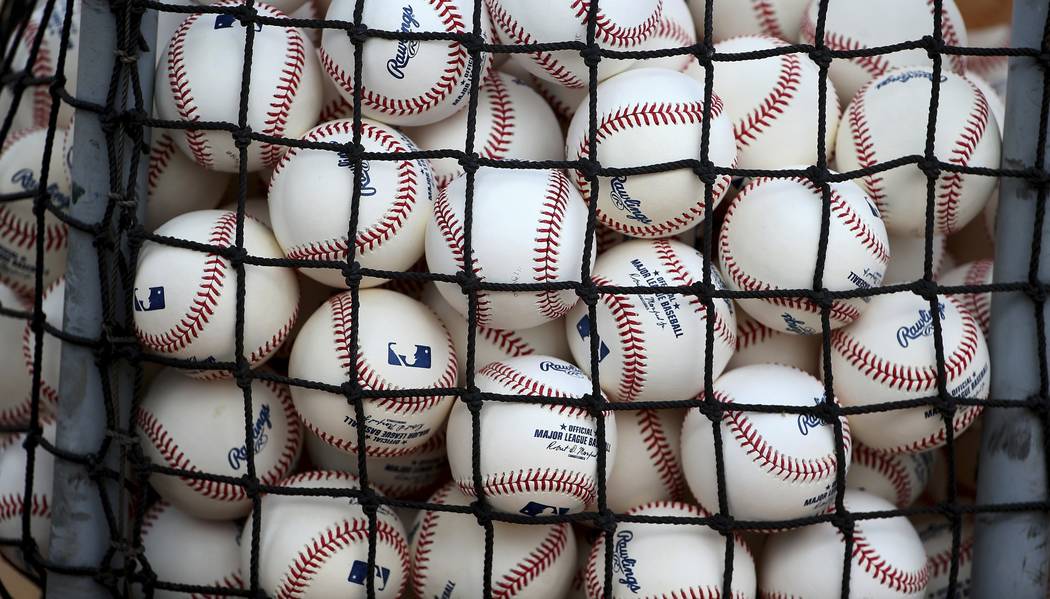 New baseballs await being used during workouts at the Cincinnati Reds spring training baseball facility, Wednesday, Feb. 13, 2019, in Goodyear, Ariz. (AP Photo/Ross D. Franklin)