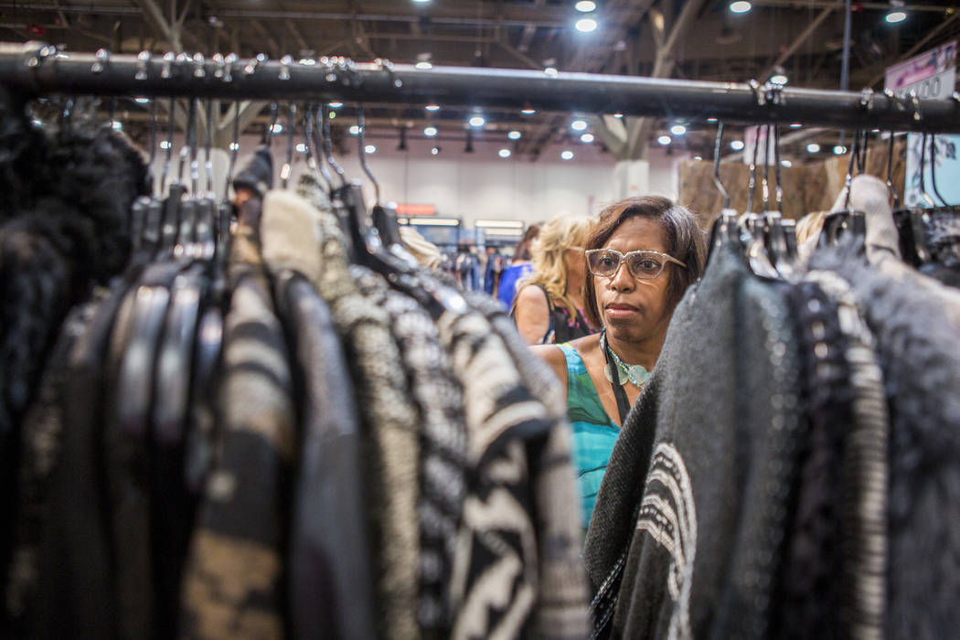 Marilyn Craig of Southfield, Mich., browses clothes by Nostalgia at the MAGIC trade show inside the Las Vegas Convention Center on Tuesday, Aug. 15, 2017. Patrick Connolly Las Vegas Review-Journa ...