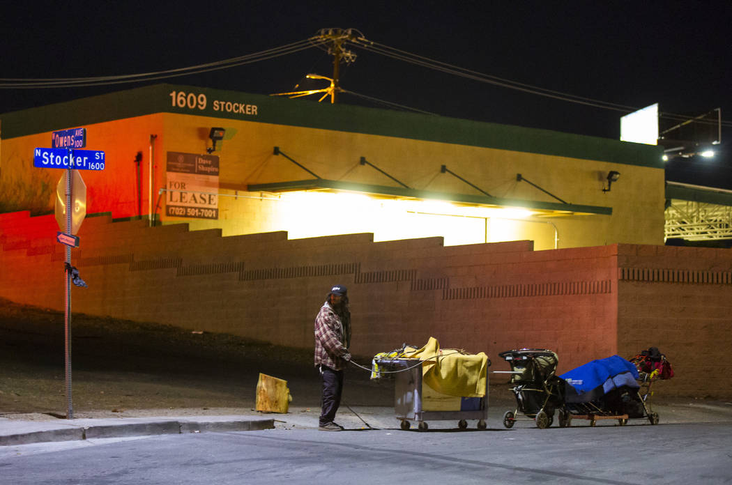 A homeless man moves his belongings along Stocker Street at Owens Avenue during the annual Southern Nevada Homeless Census in Las Vegas on Tuesday, Jan. 22, 2019. (Chase Stevens/Las Vegas Review-J ...