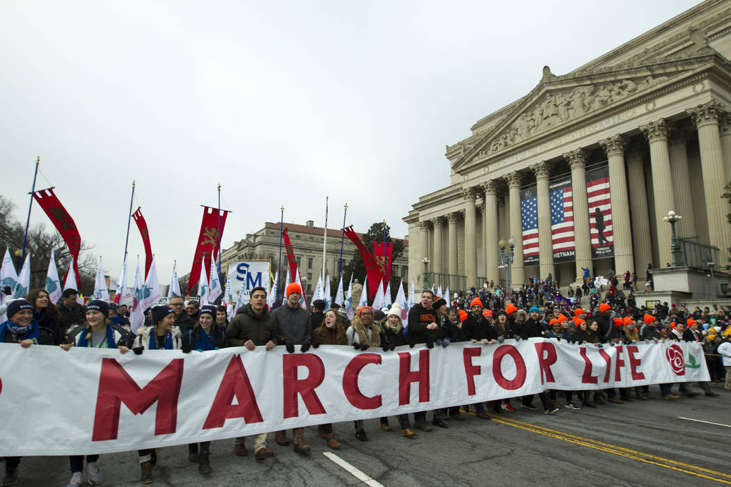 Anti-abortion activists march towards the U.S. Supreme Court during the March for Life in Washington Friday, Jan. 18, 2019. (AP Photo/Jose Luis Magana)