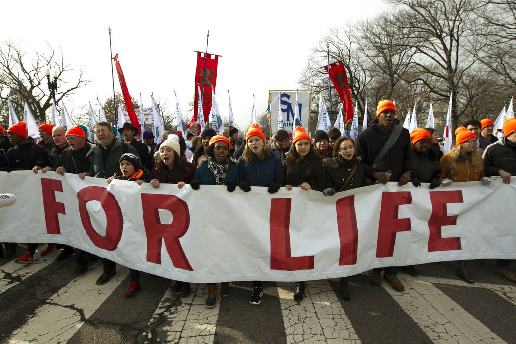 Anti-abortion activists march towards the U.S. Supreme Court, during the March for Life in Washington, Friday, Jan. 18, 2019. (AP Photo/Jose Luis Magana)