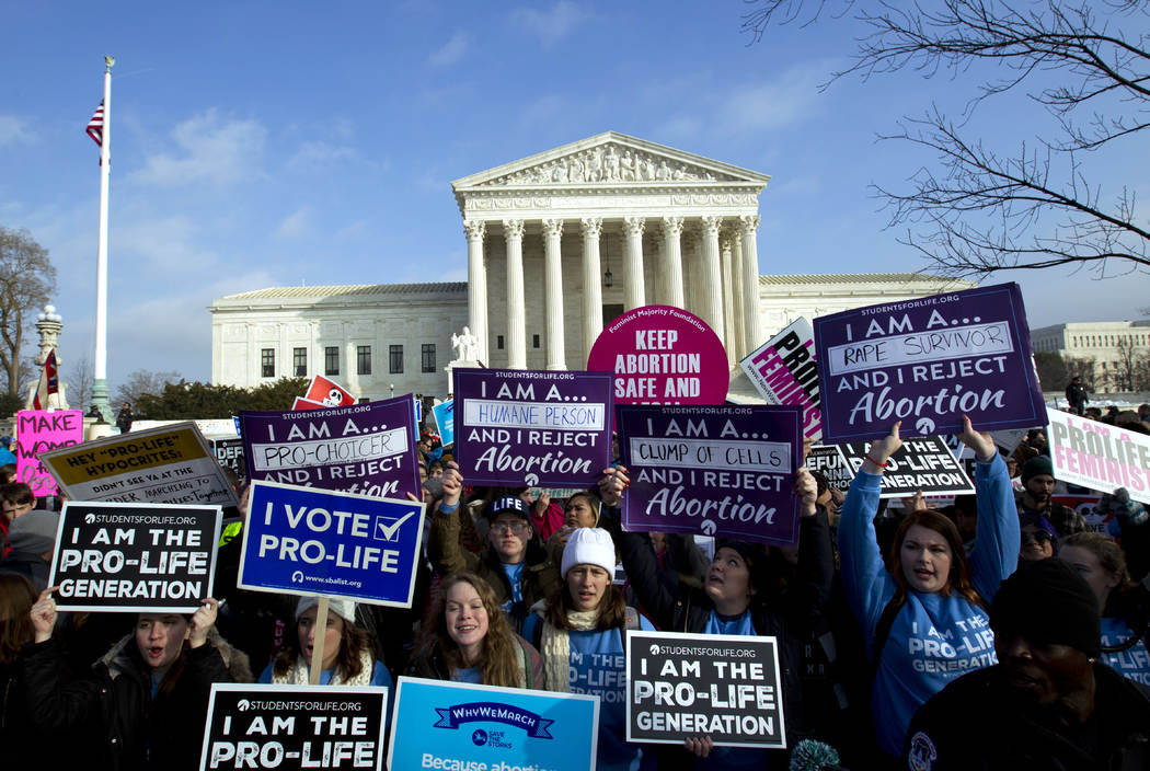 Anti-abortion activists protest outside of the U.S. Supreme Court, during the March for Life in Washington Friday, Jan. 18, 2019. (AP Photo/Jose Luis Magana)