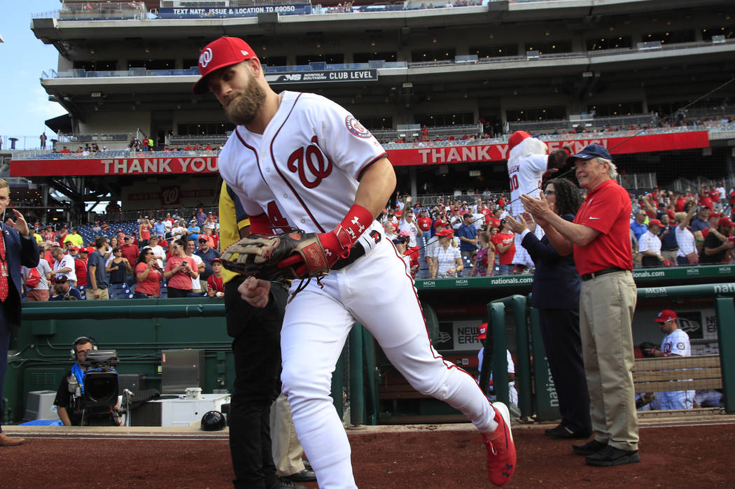 Washington Nationals right fielder Bryce Harper (34), runs to the field from the dug out at the start of the Nationals last home game of the season during a baseball game against the Miami Marlins ...