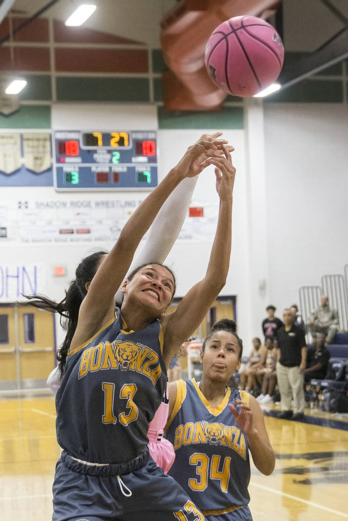 Bonanza senior Macyn Raleigh (13) fights for a rebound with Shadow Ridge sophomore Nadia Morales (20) in the second quarter on Monday, Feb. 4, 2019, at Shadow Ridge High School, in Las Vegas. (Ben ...