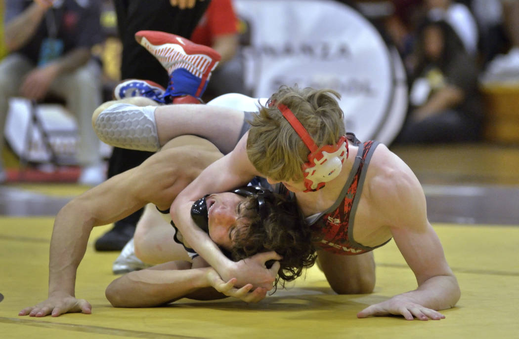 Triston Curtis of Shadow Ridge High School, left, and James Wilson from Arbor View High School compete in the Mountain Region wrestling tournament at Bonanza High School at 6665 Del Rey Ave. in La ...