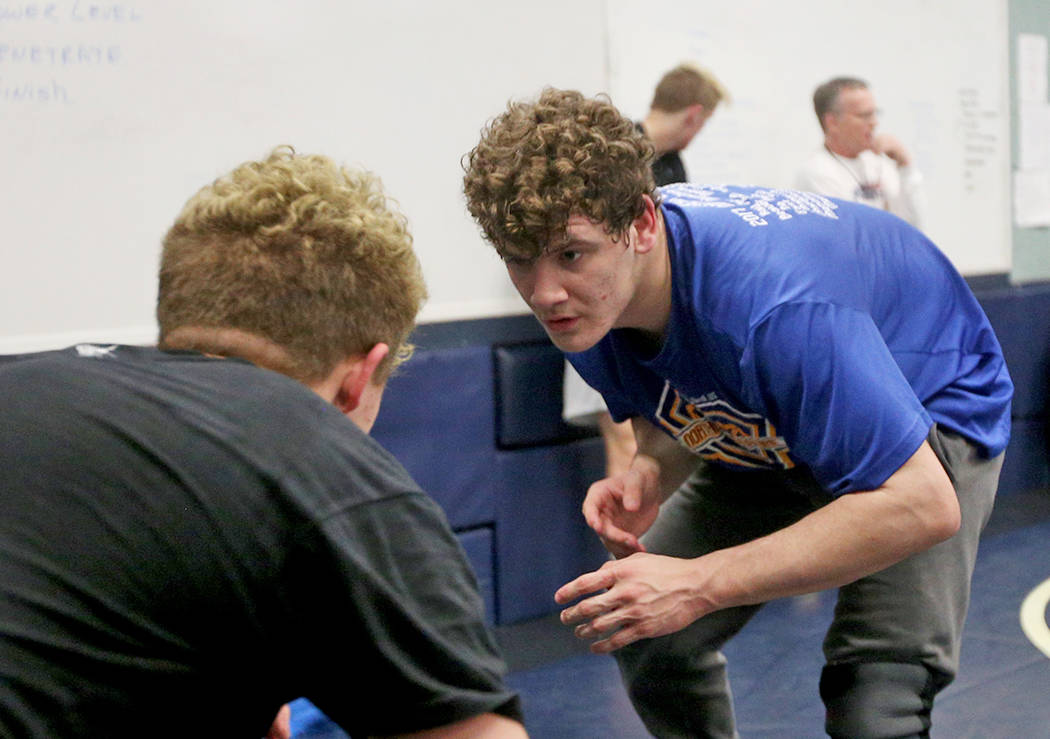 Ashton King, left, wrestles against Noah Gallardo at Shadow Ridge High School in Las Vegas, Monday, Feb. 4, 2019. (Rachel Aston/Las Vegas Review-Journal) @rookie__rae