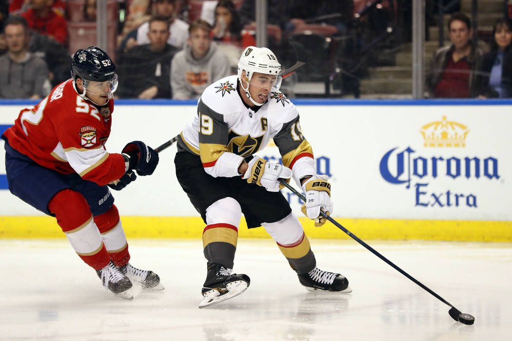 Vegas Golden Knights right wing Reilly Smith (19) skates to the net followed by Florida Panthers defenseman MacKenzie Weegar (52) during the first period of an NHL hockey game, Saturday, Feb. 2, 2 ...