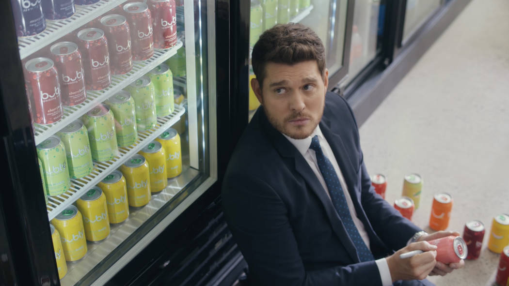 This undated screen grab from video provided by PepsiCo. shows an image from Pepsi’s Bubly sparkling water brand's 2019 Super Bowl NFL football spot featuring Michael Buble. Pepsi has long ...