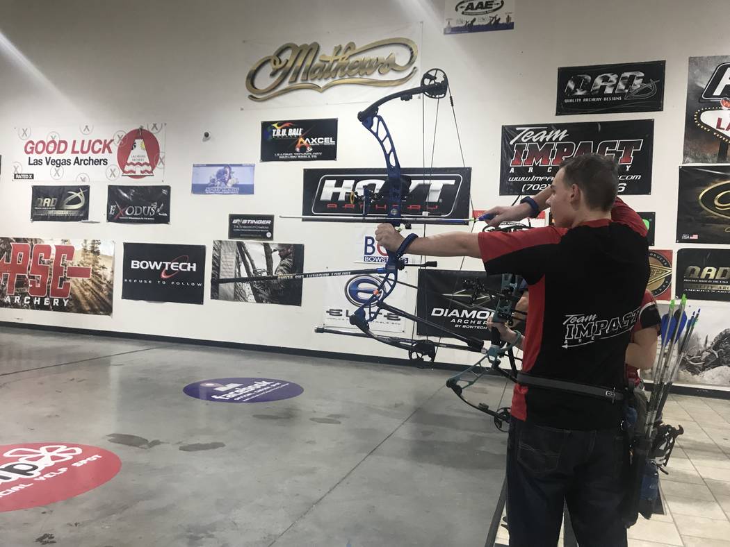 Ryan Boring shoots an arrow at Impact Archery on Friday, Feb. 1. (Rachel Spacek/Las Vegas Review-Journal @RachelSpacek)