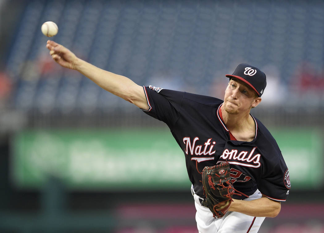 Washington Nationals starting pitcher Erick Fedde delivers a pitch during the first inning of a baseball game against the St. Louis Cardinals, Tuesday, Sept. 4, 2018, in Washington. (AP Photo/Nick ...