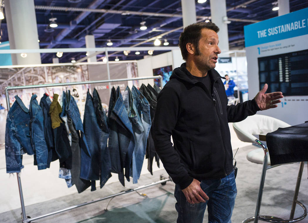 Alex Penades, brand manager at Jeanologia, talks about the benefits of using eco-friendly technology in the production of jeans and other apparel during the Sourcing at MAGIC trade show at the Las ...