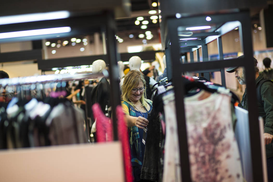 Cynthia Fisher of Washington looks at items from Vocal Apparel at the MAGIC trade show at the Las Vegas Convention Center in Las Vegas on Wednesday, Feb. 6, 2019. (Chase Stevens/Las Vegas Review-J ...