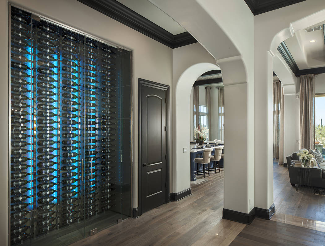 This contemporary lighted wine wall cellar by Innovative Wine Cellar Designs is dual-sided and can be seen from the hallway and the dining room. (Michael Baxter/Baxter Imaging LLC)