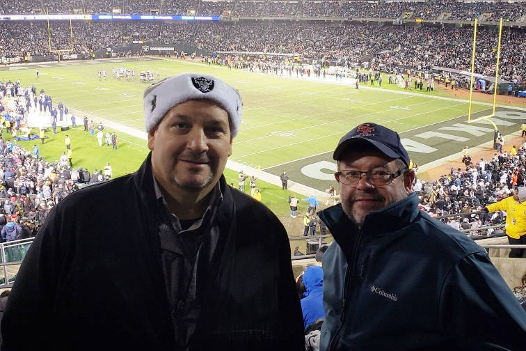 Dan Holmgren, left, and friend Rich Newmark are shown at Oakland Coliseum during the Raiders game against the Denver Broncos on Dec. 24, 2018. Holmgren was terminated as a Las Vegas limousine driv ...