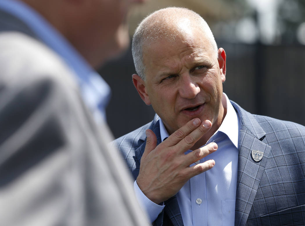 Raiders president Marc Badain talks with local officials during a tour of the University of Nevada, Reno athletic facilities in Reno, Nev., on Thursday, Aug. 16, 2018. The Raiders are considering ...