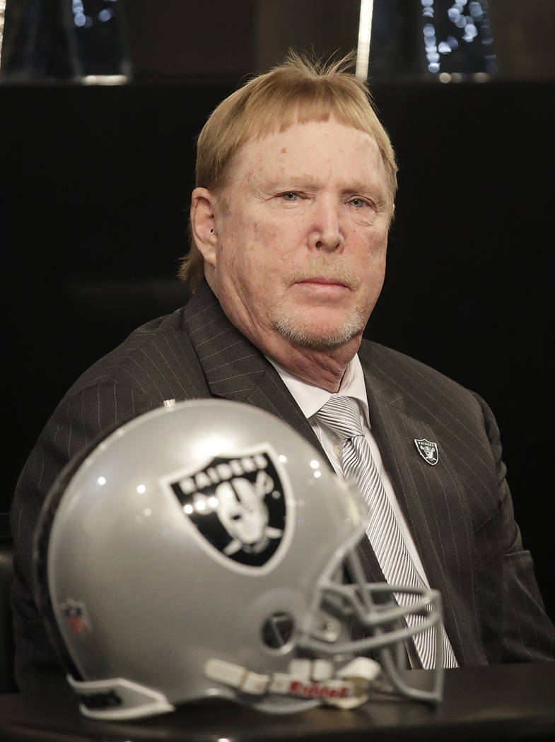 Oakland Raiders owner Mark Davis listens to speakers at a news conference announcing Mike Mayock as the team's general manager at the team's headquarters in Oakland, Calif., Monday, Dec. 31, 2018. ...