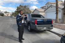Anthony Coleman, a parking enforcement officer with the City of North Las Vegas, observes what seems to be an abandoned vehicle in a residential area at the northwest end of the city. (Mia Sims/ L ...