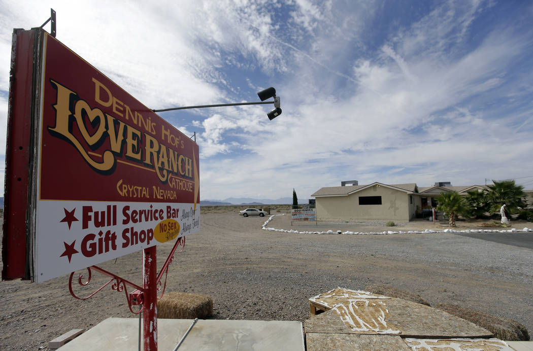 A sign advertises the Love Ranch brothel in Crystal, Nevada. (Chris Carlson/The Associated Press)