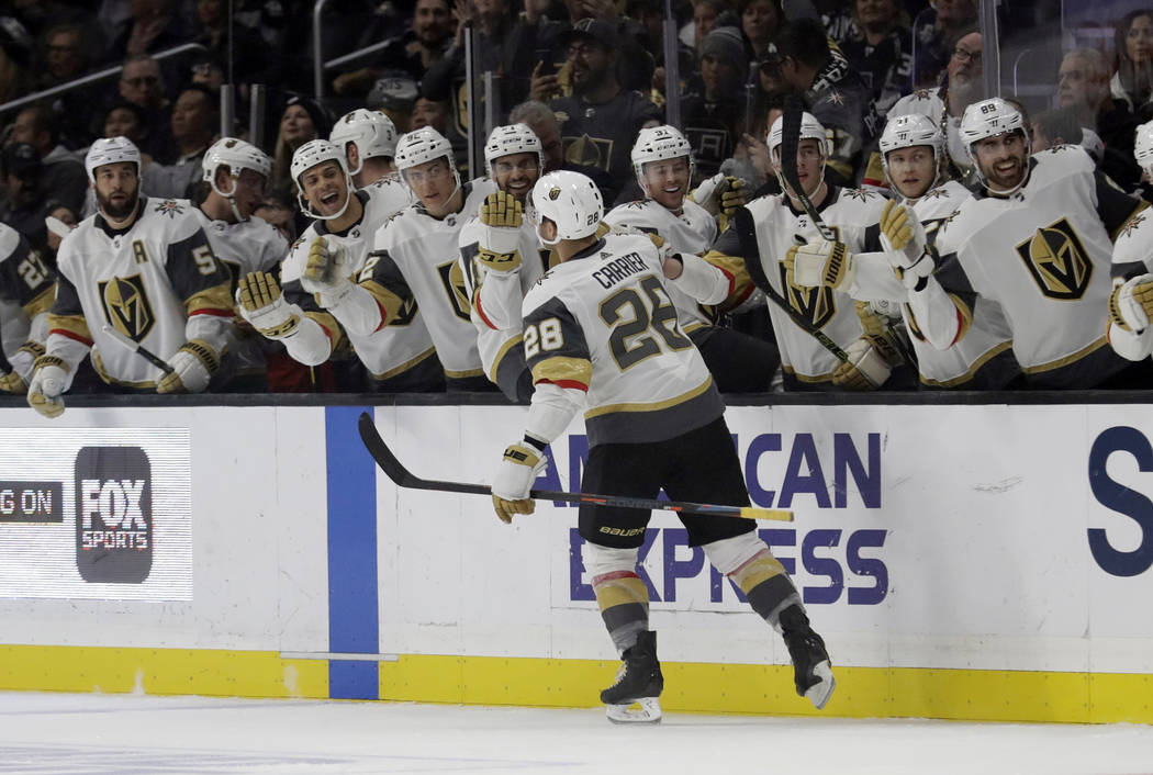 Vegas Golden Knights' William Carrier (28) celebrates with teammates after scoring against the Los Angeles Kings during the first period of an NHL hockey game Saturday, Dec. 29, 2018, in Los Angel ...