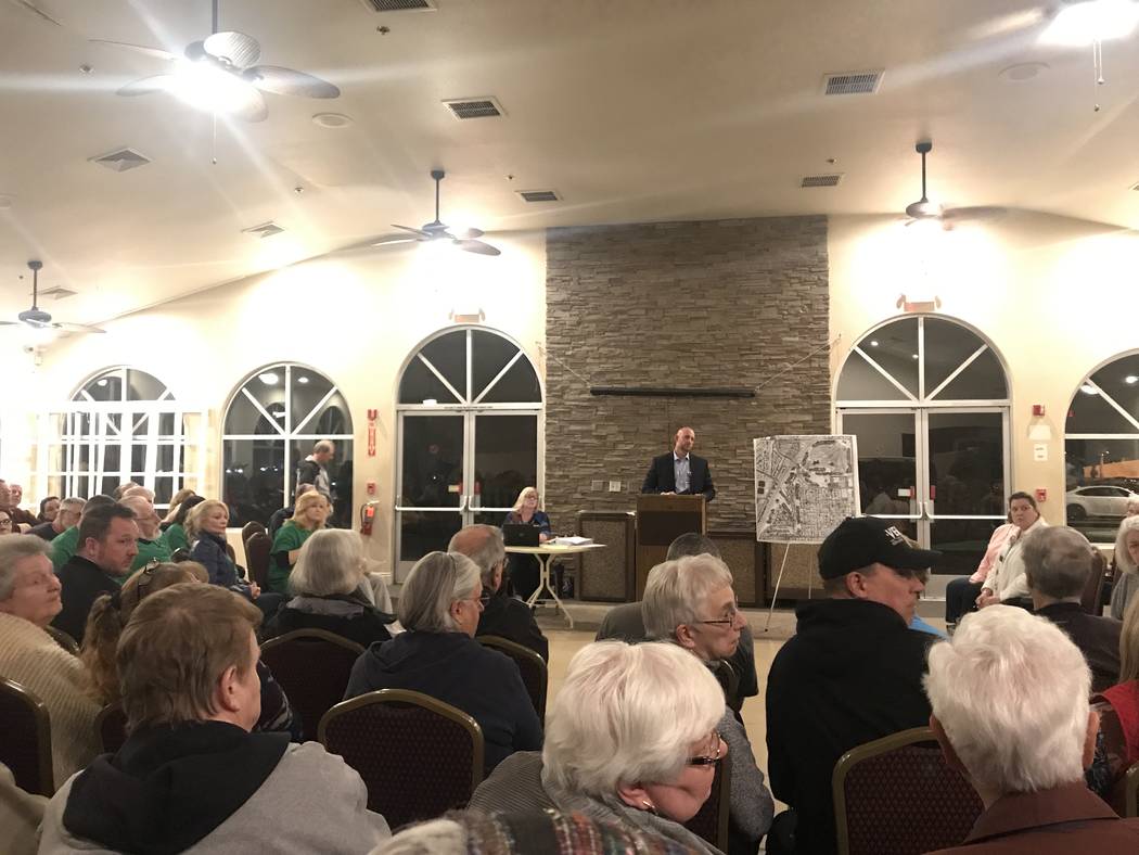 Michael Tassi, community development and services department director for the City of Henderson, takes questions at the neighborhood meeting at Black Mountain Golf Course and Country Club on Monda ...