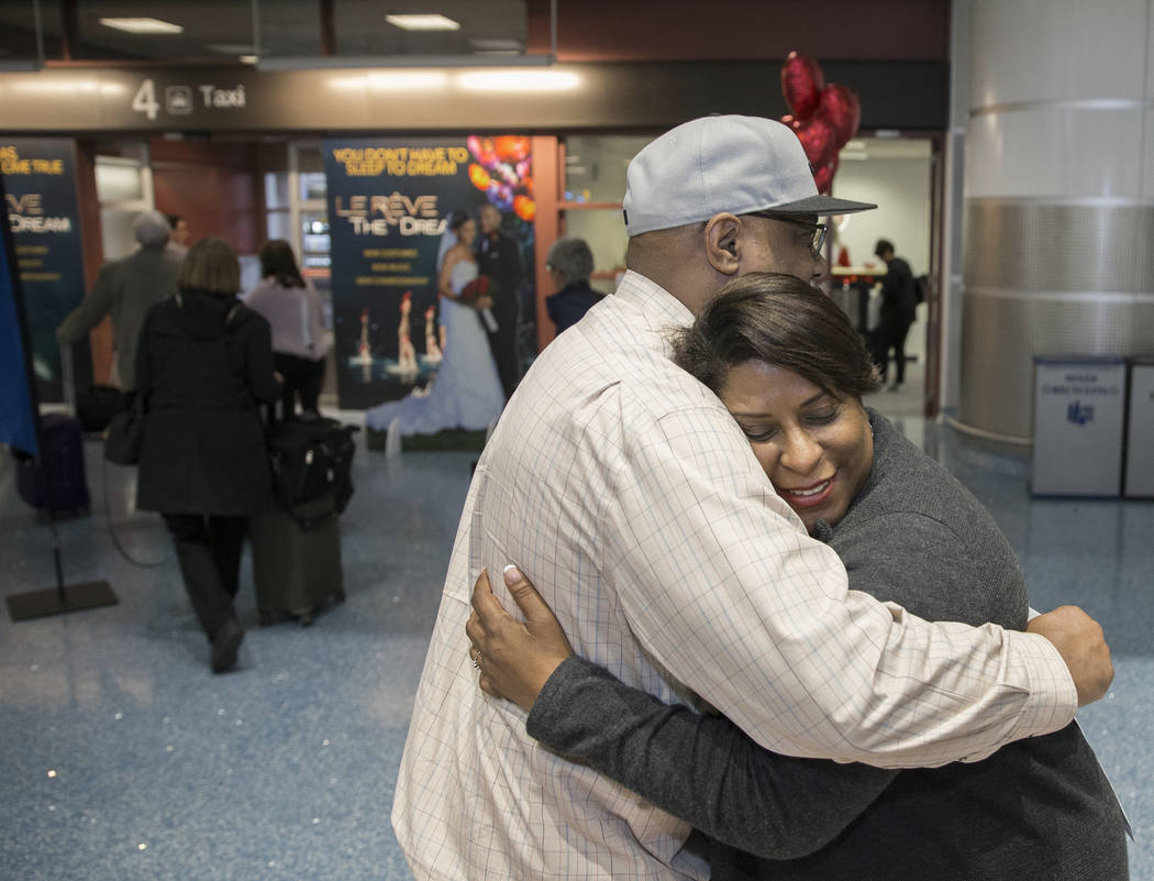 Tandra Jones, right, from Charleston, S.C., hugs husband Dennis after getting their marriage license at a Clark County pop-up office in the baggage claim area at Terminal 1 on Wednesday, Feb. 13, ...